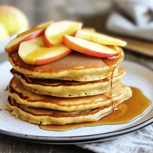 - 1 cup rolled oats - 1 cup cottage cheese - 3 large eggs - 1 teaspoon baking powder - 1 teaspoon cinnamon - 1 medium apple, grated - Pinch of salt - Cooking spray or coconut oil for the pan These main ingredients form the base of your protein pancakes. The rolled oats give them a hearty texture. Cottage cheese adds protein and makes them fluffy. Eggs help bind everything together, while the apple brings natural sweetness. Baking powder and cinnamon enhance the flavor and fluffiness. - 1 tablespoon maple syrup (optional, for sweetness) - Sliced apples and a sprinkle of cinnamon for topping Adding maple syrup is a great way to sweeten your pancakes. Topping with sliced apples and cinnamon adds a lovely touch. These optional ingredients can elevate your breakfast experience. Each serving of these pancakes is packed with nutrients. You get about 20 grams of protein and healthy carbs from the oats and apples. They are low in sugar, especially if you skip the maple syrup. This breakfast is not just tasty; it supports your fitness goals too. Enjoy a meal that fuels your day! To make the batter, grab your blender or food processor. Add 1 cup of rolled oats. Then, mix in 1 cup of cottage cheese. Next, crack in 3 large eggs. Add 1 teaspoon of baking powder and 1 teaspoon of cinnamon. Grate 1 medium apple and toss it in. If you like a bit of sweetness, add 1 tablespoon of maple syrup. Finally, add a pinch of salt. Blend everything until it is smooth and well combined. This batter should be thick but pourable. Next, heat a non-stick skillet over medium heat. Lightly coat the skillet with cooking spray or coconut oil. Pour about 1/4 cup of the batter for each pancake onto the skillet. Cook until bubbles form on the surface, which takes about 2 to 3 minutes. After that, carefully flip the pancakes. Cook for another 2 to 3 minutes until they are golden brown and cooked through. Remove the pancakes from the skillet and place them on a warm plate. Repeat this process with the remaining batter. Serve the pancakes warm for the best taste. Top them with sliced apples for a fresh crunch. Add a sprinkle of cinnamon for extra flavor. If you want more sweetness, drizzle some maple syrup on top. Enjoy your delicious, protein-packed breakfast! To get the best texture, blend your ingredients well. This helps mix the oats with the cottage cheese and eggs. A smooth batter makes a fluffy pancake. If the batter seems too thick, add a splash of water or milk. This will loosen it up. Let the batter sit for a few minutes. This allows the oats to absorb some moisture, making your pancakes softer. Flipping pancakes can be tricky, but practice makes perfect. Wait until bubbles form on the surface before flipping. This shows the pancake is ready. Use a thin spatula to slide under the pancake. Lift it gently. Turn it over quickly but carefully. Cook it until both sides are golden brown. If you find it hard to flip, try smaller pancakes. They are easier to handle. Adding protein to your pancakes has great benefits. Protein helps build muscles and keeps you full longer. Using cottage cheese adds creaminess and protein. Each serving of these pancakes packs a protein punch. This makes them a smart choice for breakfast or a snack. You can enjoy them without feeling guilty. Plus, they taste amazing with apples and cinnamon! {{image_2}} To make these pancakes gluten-free, swap rolled oats for certified gluten-free oats. You can also use a gluten-free all-purpose flour. This keeps your pancakes light and fluffy while being safe for those with gluten allergies. For a vegan version, replace cottage cheese with silken tofu or a plant-based yogurt. Use flax eggs instead of real eggs. To make a flax egg, mix 1 tablespoon of ground flaxseed with 2.5 tablespoons of water. Let it sit for about five minutes to thicken. Feel free to customize your pancakes with fruits and nuts. Add blueberries, bananas, or walnuts to the batter for extra flavor. Chopped pecans or almonds work well too. Just remember to adjust the cooking time slightly if you add a lot of extras. To keep your leftover pancakes fresh, stack them in an airtight container. Place parchment paper between each pancake. This step prevents them from sticking together. Store the container in the fridge if you plan to eat them within a few days. They stay good for about 3 to 5 days in the fridge. When you’re ready to enjoy your pancakes again, you can reheat them quickly. The best method is to use a skillet. Heat your skillet over low heat and place the pancakes in it. Cook for about 1 to 2 minutes on each side. You can also use a microwave. Just heat them for 20 to 30 seconds. If you want to save pancakes for a longer time, freezing is a great option. Let the pancakes cool completely first. Then, stack them with parchment paper between each one. Place the stack in a freezer-safe bag or container. They can last for up to 2 months in the freezer. When you’re ready to eat, simply reheat them from frozen. Yes, you can make these pancakes ahead of time. Cook them and let them cool. After that, store them in an airtight container in the fridge. They will stay fresh for about three days. You can also freeze them. Just place sheets of parchment paper between each pancake to stop them from sticking. When ready, you can reheat them in the microwave or on a skillet. If you do not have cottage cheese, you can use Greek yogurt. It will give a creamy texture and add protein too. You can also try ricotta cheese, which has a similar texture. Both options work well, but they may change the flavor slightly. To make these pancakes sweeter, add more maple syrup to the batter. Start with an extra tablespoon and taste. If you want more sweetness, you can also mix in a little honey or agave syrup. For a natural sweet taste, try adding more grated apple or some mashed banana. You learned about pancake ingredients, preparation, and storage. We explored tips for texture and health benefits. Variations make these pancakes great for everyone, including gluten-free and vegan eaters. Make these pancakes your go-to breakfast. They are easy to customize and store. Enjoy making them again and again!