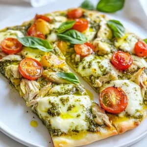 To make a tasty pesto chicken flatbread, you need these simple ingredients: - Flatbreads (store-bought or homemade) - Cooked chicken breast - Pesto sauce (store-bought or homemade) - Cherry tomatoes - Mozzarella cheese - Grated Parmesan cheese - Fresh basil leaves - Seasoning (salt and pepper) - Olive oil for drizzling Each ingredient plays a role in this dish. The flatbread serves as the base, providing a soft and crispy texture. The cooked chicken adds protein and flavor, while the pesto sauce gives a fresh herb taste. Cherry tomatoes add sweetness and color, and the cheeses melt beautifully, creating a rich topping. Fresh basil enhances the flavor and adds a pop of green. You can use store-bought ingredients to save time or make your own for a personal touch. This flexibility makes the recipe easy and fun for everyone. You can mix and match flavors to suit your taste, making each flatbread unique. Enjoy the process of gathering these ingredients and preparing a meal that everyone will love! {{ingredient_image_1}} First, set your oven to 400°F (200°C). This temperature helps the cheese melt perfectly. Next, take your flatbreads and place them on a baking sheet. Drizzle a bit of olive oil on each flatbread. Use a brush or your fingers to spread the oil evenly. This step adds flavor and helps the flatbread crisp up. Now it’s time to assemble! Spread the pesto sauce generously over each flatbread. Make sure to cover the base well. In a bowl, mix the shredded chicken with salt and pepper. Then, evenly distribute the chicken on top of the pesto. Next, scatter the halved cherry tomatoes over the chicken. Finally, sprinkle mozzarella cheese on top, followed by the grated Parmesan cheese. Place the baking sheet in the oven and bake for about 12 to 15 minutes. Keep an eye on your flatbreads. They’re ready when the cheese is bubbly and slightly golden. When done, remove them from the oven and let them cool for a couple of minutes. Before serving, top with torn basil leaves for extra flavor. Enjoy your tasty creation! To make the best pesto chicken flatbread, you need to focus on two key areas: cheese melt and pesto amount. - Achieving the right cheese melt: Use fresh mozzarella for a gooey texture. Shred it yourself for better melting. Spread it evenly on top of the chicken and tomatoes. This helps it melt perfectly and form a lovely, golden layer. - Using the perfect amount of pesto: Don’t skimp on the pesto. Spread about 1/4 cup on each flatbread. This gives a strong flavor base. Too little, and your flatbread may taste bland. If you love pesto, add more after baking for a fresh kick. Serving your flatbread well makes it even more inviting. Here’s how to present it beautifully. - Presentation tips for a beautiful serving: Use a wooden board or a large plate. Drizzle some extra pesto over the top. Add torn basil leaves for color. This not only looks nice, but it also enhances flavor. - Suggested side dishes to complement the meal: A simple side salad works great. Try a mix of greens with a light vinaigrette. You can also serve some crunchy carrot sticks or a bowl of olives on the side. These add texture and freshness to your meal. Pro Tips Tip Title: Use Fresh Ingredients: For the best flavor, opt for fresh basil and high-quality mozzarella. Fresh ingredients elevate the dish. Tip Title: Customize Your Toppings: Feel free to add other toppings like olives, red onions, or even arugula for extra flavor and texture. Tip Title: Perfect Baking Time: Keep a close eye on the flatbreads while baking. Remove them when the cheese is bubbly and golden to avoid burning. Tip Title: Serve Immediately: These flatbreads are best enjoyed fresh out of the oven. Serve them right away to appreciate the melted cheese and fresh toppings. {{image_2}} You can easily change the protein in this recipe. Instead of chicken, try turkey or shrimp. Both options will bring great flavor. If you want a vegan or vegetarian flatbread, use chickpeas or tofu instead of chicken. You can also use a plant-based pesto. This swap keeps it fresh and tasty. Add more toppings to make your flatbread exciting. Consider sliced olives, spinach, or artichokes for extra taste. You can sprinkle some red pepper flakes for a little heat. If you want a different sauce, try BBQ or a garlic sauce. These options will change the flavor and give you new ideas to explore. To keep your pesto chicken flatbread fresh, follow these steps: - Let the flatbread cool to room temperature. - Wrap each piece in plastic wrap or foil. - Place it in an airtight container. - Keep it in the fridge for up to three days. If you want to freeze it, here’s what to do: - Wrap the cooled flatbread tightly in plastic wrap. - Place it in a freezer-safe bag or container. - It can stay in the freezer for up to three months. Reheating flatbread is easy, and you want it to taste great. Here are some methods: - Oven: Preheat to 350°F (175°C). Place flatbread on a baking sheet. Heat for about 10 minutes. This keeps it crispy. - Skillet: Heat a non-stick skillet over medium heat. Place the flatbread in the skillet. Cook for about 3-4 minutes on each side. To keep the flatbread crispy: - Avoid the microwave if you can. It makes the flatbread soggy. - If using the skillet, cover it with a lid for even warmth. Enjoy your tasty leftovers! To make great homemade pesto, you need simple ingredients. Here’s what you need: - 2 cups fresh basil leaves - 1/2 cup olive oil - 1/2 cup grated Parmesan cheese - 1/3 cup pine nuts or walnuts - 2 cloves garlic - Salt and pepper to taste Start by adding the basil, nuts, and garlic to a food processor. Pulse until finely chopped. Then, with the processor running, slowly pour in the olive oil until it blends well. Finally, mix in the cheese and season with salt and pepper. This fresh pesto adds a bright flavor to your flatbread. Yes, you can switch up the cheese in your flatbread. If you want, try: - Feta cheese for a tangy twist - Gouda cheese for a smoky flavor - Vegan cheese for a plant-based option Each cheese brings a unique taste, and you can mix them too! Be creative and find what you like best. Absolutely, this pesto chicken flatbread is great for meal prep! Here are some tips: - Prepare the flatbreads in advance and store them in the fridge. - Keep the toppings separate to maintain freshness. - Use airtight containers for storage. You can assemble and bake them when you're ready to eat. This makes it easy to enjoy a tasty meal any day! This blog post covered how to make delicious chicken flatbreads. We discussed the key ingredients, like flatbreads and pesto. I shared step-by-step instructions to guide you through prepping, assembling, and baking. You also learned tips for perfecting the dish and tasty variations to try. Finally, we explored how to store leftovers and reheat them for the best taste. Making chicken flatbreads is simple and fun, allowing you to impress friends or enjoy a tasty meal anytime. Enjoy creating your flatbreads!