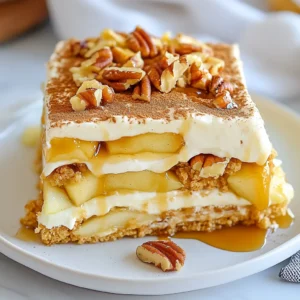 To make this delightful dessert, gather these key ingredients: - 1 ½ cups heavy whipping cream - 1 cup powdered sugar - 1 teaspoon vanilla extract - 1 package (3.4 oz) instant vanilla pudding mix - 2 cups milk - 1 box (15 oz) graham crackers - 2 medium apples, peeled and diced (preferably Granny Smith) - 1 cup caramel sauce (store-bought or homemade) These ingredients work together to create a creamy and sweet treat. The graham crackers form the base, while the whipped cream adds lightness. You can make your cake even better with some easy toppings: - ¼ cup chopped pecans - Cinnamon for dusting Adding chopped pecans gives a nice crunch. A sprinkle of cinnamon enhances the flavor and adds warmth. For the best taste, I recommend using Granny Smith apples. They are tart and balance the sweetness of the caramel. Other good options include Honeycrisp or Fuji apples if you want a sweeter bite. These apples keep their shape well when mixed into the cake. {{ingredient_image_1}} To make the Caramel Apple Éclair Cake, start by whipping the cream. In a large bowl, add 1 ½ cups of heavy whipping cream. Use a mixer to whip until soft peaks form. This means the cream should hold a shape but still be soft. Next, slowly add 1 cup of powdered sugar and 1 teaspoon of vanilla extract. Keep whipping until it becomes thick. Set this aside for later. In another bowl, mix 3.4 ounces of instant vanilla pudding with 2 cups of milk. Whisk this for 2 to 3 minutes. You want it smooth and thick. Once it’s ready, gently fold the whipped cream into the pudding. Be careful not to stir too hard. You want to keep the air in the cream. Now it’s time to layer the cake. Grab a 9x13 inch baking dish. Start by laying down a full layer of graham crackers. Cover the bottom completely. Next, spread half of the pudding mixture over the graham crackers. Smooth it out evenly with a spatula. Now, sprinkle half of the diced apples on top of the pudding. Drizzle some caramel sauce over the apples. You can use store-bought or homemade sauce. Then, add another layer of graham crackers on top. Follow with the rest of the pudding mixture and the remaining apples. Drizzle more caramel sauce on top. Finish with one last layer of graham crackers. Whipping cream can be tricky, but here are some tips. Start with cold cream for better results. Use a chilled bowl and beaters if you can. This helps the cream whip faster. Don’t over-whip the cream; it should be thick but not grainy. If you see butter forming, stop immediately. This can ruin your dessert. Keep these tips in mind, and you’ll have perfect whipped cream every time. To get a creamy and light texture, whip your heavy cream until it forms soft peaks. This means the cream should hold its shape but still be soft. When you mix in the powdered sugar and vanilla, keep whipping until the cream is thick and holds stiff peaks. This makes your cake light. When you combine the whipped cream with the pudding, fold gently. This keeps the air in the cream, making your cake fluffy. One common mistake is over-whipping the cream. If you whip it too much, it can turn grainy. Another error is not letting the layers chill long enough. If you skip this step, the layers won’t soften and blend, making the cake hard to cut. Make sure to cover your dish tightly to avoid any unwanted odors from the fridge. When it’s time to serve, cut the cake into nice squares. You can sprinkle chopped pecans on top for a nice crunch. A light dusting of cinnamon adds a warm flavor. If you want to make it extra special, drizzle more caramel sauce over each slice before serving. This makes it look pretty and tastes amazing! Pro Tips Choose the Right Apples: Granny Smith apples are tart and hold up well in this dessert, providing a perfect contrast to the sweetness of the caramel. Chill Overnight: For the best texture and flavor, let the cake chill overnight. This allows the graham crackers to soften and the flavors to meld beautifully. Homemade Caramel Sauce: If you have time, try making your own caramel sauce. It adds a richer flavor and can be customized to your taste. Serving Suggestions: Serve this dessert with a dollop of whipped cream or a scoop of vanilla ice cream for an extra indulgent treat. {{image_2}} You can change the apples to other fruits. Try pears for a sweet twist. You can also use berries like strawberries or blueberries for a fresh flavor. Bananas add a nice creaminess too. Just remember to slice them thin. Each fruit brings a new taste to the cake. To make this cake gluten-free, use gluten-free graham crackers. You can also swap the heavy cream for coconut cream. For dairy-free options, use almond milk instead of regular milk. These changes keep the cake tasty without dairy or gluten. You still get that layered dessert feel. Add a splash of caramel extract for a richer flavor. Mixing in some chocolate chips can make it even more fun. You can also fold in crushed cookies for extra texture. These infusions create layers of flavor. Feel free to get creative with what you have. Each change makes the cake uniquely yours. To keep your Caramel Apple Éclair Cake fresh, store it in the fridge. Cover it tightly with plastic wrap or foil. This helps keep the moisture in and the flavors strong. Make sure to avoid any strong-smelling foods in the fridge, as they can affect the cake's taste. The cake stays good for about 3 to 5 days in the fridge. After that, the texture might change. It can become soggy from the layers mixing too much. If you want to enjoy it later, consider freezing it. To freeze the Éclair Cake, first, wrap it well in plastic wrap. Then, put it in a freezer-safe container. It can last up to 2 months in the freezer. When you're ready to eat it, move it to the fridge to thaw for about 6 to 8 hours. Avoid reheating; this cake tastes best cold and creamy. Yes, you can switch flavors! Try chocolate or butterscotch pudding for a fun twist. You can also blend flavors, like vanilla and caramel, to create unique tastes. Just keep in mind that different flavors may change the overall taste of the cake. Experiment with your favorites! If you don't have heavy whipping cream, you can use coconut cream. It whips up nicely and adds a light coconut flavor. Another option is to use whipped topping, which is easy and quick. However, it may not have the same richness. To make a mini version, use a smaller dish, like an 8x8 inch pan. Cut the ingredients in half for the right amount. You can also layer individual cups for fun servings. Just remember to adjust the chilling time, as smaller portions may set faster. This blog post covered how to make a tasty caramel apple éclair cake. We explored key ingredients and optional toppings, along with the best apple choices. I shared step-by-step instructions for layering the cake and tips for whipping cream just right. You learned about variations and gluten-free options, plus how to store or freeze your cake. In closing, enjoy making this fun dessert your own. With these tips, your éclair cake will delight everyone.