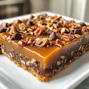 - 1 cup unsalted butter, softened - 1 cup brown sugar, packed - 1 cup granulated sugar - 2 large eggs - 1 teaspoon vanilla extract - 2 cups all-purpose flour - 1/2 teaspoon salt - 1 teaspoon baking powder - 1 cup semi-sweet chocolate chips - 1 cup chopped pecans (or walnuts) - 1 cup caramel sauce (store-bought or homemade) Using quality ingredients makes a big difference in taste. Fresh butter adds rich flavor. Brown sugar gives a nice depth. Eggs provide structure and moisture. Good chocolate chips melt smoothly, creating a perfect gooey texture. Fresh nuts add crunch and flavor. Using homemade caramel sauce can elevate your bars even more. This care ensures your turtle bars taste fantastic. You can easily adapt this recipe for different diets. If you need it dairy-free, use vegan butter and dairy-free chocolate chips. For a nut-free version, skip the nuts or use seeds instead. If you want a gluten-free option, try using a gluten-free flour blend. These simple swaps allow everyone to enjoy these tasty treats. {{ingredient_image_1}} Start by setting your oven to 350°F (175°C). This heat will help the bars bake evenly. Next, grab a 9x13-inch baking pan. Grease it well with butter or line it with parchment paper. This makes it easy to take out the bars later. In a big mixing bowl, add 1 cup of softened unsalted butter. Then, add 1 cup of packed brown sugar and 1 cup of granulated sugar. Use an electric mixer to combine them. Mix for about 3 to 4 minutes. You want it light and fluffy. Next, add 2 large eggs, one at a time. Mix well after each egg. Finally, stir in 1 teaspoon of vanilla extract until everything is blended. In another bowl, whisk together 2 cups of all-purpose flour, 1/2 teaspoon of salt, and 1 teaspoon of baking powder. Gradually add this dry mix to the wet ingredients. Mix just until combined. Be careful not to over-mix. Gently fold in 1 cup of semi-sweet chocolate chips and 1 cup of chopped pecans. Reserve a bit of each for the top if you want. Spread half of the batter into the prepared pan. Bake this layer for 15 minutes. Take it out and drizzle half of the caramel sauce over it. Spoon dollops of the remaining batter on top. It’s fine if some caramel shows. Bake again for 20 to 25 minutes. The top should be golden brown. Use a toothpick to check if it comes out clean. As soon as the bars are done, drizzle the rest of the caramel sauce on top. Add the reserved chocolate chips and pecans. Let the bars cool in the pan on a wire rack before you cut them into squares. To get the best texture, focus on mixing. Cream the butter and sugars well. This step adds air and makes the bars fluffy. Mix until light and fluffy, about three to four minutes. Don’t over-mix after adding flour; stop once combined. This keeps the bars soft. Store any leftover turtle bars in an airtight container. Keeping them sealed helps maintain their freshness. You can store them at room temperature for up to five days. For longer storage, place them in the fridge. They will last up to two weeks in the fridge. Get creative with toppings to boost flavor. Drizzle extra caramel sauce on top for a sweet treat. A sprinkle of sea salt contrasts well with the caramel. You can also add a dusting of powdered sugar for a sweet touch. Consider using chopped nuts for a crunch. Pro Tips Use Room Temperature Ingredients: Ensure your butter and eggs are at room temperature for better mixing and a fluffier texture. Customize Your Nuts: Feel free to substitute pecans with walnuts or even almonds for a different flavor profile! Watch the Baking Time: Keep an eye on the bars towards the end of baking; they can go from perfect to overbaked quickly. Cool Completely: Allow the bars to cool completely in the pan before cutting to achieve clean, even squares. {{image_2}} If you want to make nut-free turtle bars, it's easy! Just skip the pecans or walnuts. You can replace them with crispy rice cereal. This gives a nice crunch without adding nuts. Another option is to use sunflower seeds. They add a bit of texture and flavor. Your turtle bars will still taste great! You can mix up the chocolate you use in the bars. If you prefer dark chocolate, swap the semi-sweet chips. Dark chocolate adds a rich taste. For a sweeter option, use milk chocolate chips. You could even try white chocolate for a fun twist. Each choice gives a unique flavor to your turtle bars. Seasonal flavors can make your turtle bars special. In fall, add a pinch of cinnamon to the batter. This gives a warm spice that pairs well with caramel. In summer, mix in fresh berries like raspberries or strawberries. They add a burst of flavor and color. You can experiment with different flavors to keep the recipe fresh! To keep your turtle bars fresh, store them in an airtight container. This helps prevent them from drying out. Place parchment paper between layers to avoid sticking. Store at room temperature for up to five days. If you need to keep them longer, freezing is a great option. To freeze turtle bars, cut them into squares first. Place the squares in a single layer on a baking sheet. Freeze for about two hours until solid. Then, transfer them to a freezer-safe bag or container. They can last for up to three months in the freezer. Just thaw them in the fridge before serving. If you want a warm treat, reheat the bars in the oven. Preheat the oven to 300°F (150°C). Place the bars on a baking sheet and warm them for about 10 minutes. You can also use the microwave. Heat a single bar for about 15-20 seconds. Enjoy them warm for that gooey caramel experience! Yes, you can make Turtle Bars ahead of time. Bake them, let them cool, and store them. Keep the bars in an airtight container. They will stay fresh for up to a week at room temperature. If you want to keep them longer, freeze them. Just wrap them well in plastic wrap and foil. When ready to eat, let them thaw at room temperature. If you want a substitute for caramel sauce, try using dulce de leche. It has a similar rich flavor. You can also make your own caramel sauce if you prefer. Just cook sugar and water until it turns golden, then add cream. Maple syrup can work too but will change the taste a bit. You will know the bars are done when the top turns a nice golden brown. A toothpick inserted in the center should come out clean. If it has wet batter on it, bake for a few more minutes. Keep an eye on them to avoid overbaking. Enjoy the lovely smell while they bake! In this post, I covered key ingredients, prep steps, and helpful tips for making Turtle Bars. Quality ingredients matter. This ensures great taste and texture. I also shared options for different diets and fun flavor twists. Remember to store leftovers wisely and follow my reheating tips for the best results. With these ideas, you can create bars that everyone will love. Enjoy your baking and make it your own!
