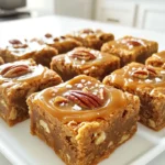 To make these blondies, you need a few key ingredients. Here’s what you will use: - 1 cup unsalted butter, melted - 1 cup brown sugar, packed - 1/2 cup granulated sugar - 2 large eggs - 1 tablespoon vanilla extract - 2 cups all-purpose flour - 1 teaspoon baking powder - 1/2 teaspoon baking soda - 1/4 teaspoon salt - 1 cup pecans, chopped - 1/2 cup salted caramel sauce - Sea salt flakes for sprinkling These ingredients create a rich, gooey base with a nice nutty crunch. The blend of sugars gives a deep flavor, while the caramel adds that sweet finish. While the main ingredients are great, you can make these blondies even better! Consider adding: - Chocolate chips for extra sweetness - A pinch of cinnamon for warmth - Dried fruits like cranberries for a tart kick These options can elevate the taste and add fun textures. Feel free to mix and match based on what you love. Not everyone has every ingredient on hand. Here are some easy swaps: - Use coconut oil instead of butter for a dairy-free option. - Try maple syrup or honey in place of granulated sugar for a natural sweet flavor. - If you have gluten-free flour, it works well instead of all-purpose flour. These substitutions ensure you can still enjoy these blondies, even if you need to adjust the recipe. Start by preheating your oven to 350°F (175°C). Grab a 9x13-inch baking pan. Grease it well with butter or cooking spray. Next, line the pan with parchment paper. Leave some paper hanging over the edges to help with easy removal later. In a large mixing bowl, add 1 cup of melted unsalted butter. Then, mix in 1 cup of packed brown sugar and 1/2 cup of granulated sugar. Whisk these together until the mixture is smooth. Crack in 2 large eggs, adding them one at a time. Stir well after each egg. Add 1 tablespoon of vanilla extract and mix until combined. In another bowl, sift together 2 cups of all-purpose flour, 1 teaspoon of baking powder, 1/2 teaspoon of baking soda, and 1/4 teaspoon of salt. Gradually add this dry mix to the wet ingredients, stirring gently. Be careful not to over-mix. Once combined, fold in 1 cup of chopped pecans and half of the 1/2 cup of salted caramel sauce. Pour the batter into your prepared pan. Smooth it out evenly. Drizzle the remaining salted caramel sauce on top. Use a knife to swirl the caramel into the batter. Bake for 25-30 minutes. Check with a toothpick; it should come out with a few moist crumbs. Let the blondies cool for 10 minutes in the pan. Lift them out using the parchment paper. After cooling completely, cut into squares and sprinkle with sea salt flakes for a tasty finish. To get a soft and chewy texture, use the right butter amount. I recommend using one cup of melted unsalted butter. This gives your blondies rich flavor and keeps them moist. Make sure you mix the sugars well with the butter. This helps create a nice base for your blondies. Mixing too much can make your blondies tough. When you add the dry ingredients, stir gently. Only mix until you see no flour. It’s fine if the batter looks a little lumpy. This helps keep your blondies soft and tender. Swirling the caramel sauce can be tricky. For best results, drizzle some caramel on top of the blondie batter. Use a knife to gently swirl it in. Don’t mix it in fully; you want to see the caramel swirls. This makes each bite delicious and full of flavor. {{image_2}} You can enhance your blondies by adding chocolate or different nuts. Mix in chocolate chips for a rich, sweet twist. Dark, milk, or white chocolate all work great. You can also try mixing in walnuts or almonds for a fun crunch. Just remember to keep the total amount the same, so your blondies bake evenly. To make gluten-free blondies, swap all-purpose flour for a gluten-free blend. Many brands offer blends that work well in baking. Check the mix for xanthan gum, which helps with texture. This way, everyone can enjoy these tasty treats without worry. You still get that soft, chewy bite! In fall, add spices like cinnamon or nutmeg for a warm flavor. Chopped apples or pumpkin puree can also make great additions. For winter, consider using peppermint extract or crushed candy canes. These flavors bring a festive touch to your blondies. You can even drizzle white chocolate on top for extra sweetness. To keep your salted caramel pecan blondies fresh, store them in an airtight container. This helps lock in moisture. Place parchment paper between layers to prevent sticking. You can also wrap each blondie in plastic wrap for extra protection. Freezing blondies is easy and fun. First, let them cool completely. Then, cut them into squares. Wrap each square tightly in plastic wrap. Place wrapped blondies in a freezer-safe bag or container. They can stay frozen for up to three months. When you're ready to enjoy, thaw them in the fridge overnight. When stored properly, blondies last about a week at room temperature. If you want them to stay fresh longer, keep them in the fridge. Check for any signs of spoilage before eating. If they are dry or hard, it’s time to toss them out. Enjoy your sweet treat while it's still soft and chewy! Blondies and brownies both have a similar base. They both use butter, sugar, and flour. The main difference is in flavor and color. Brownies get their rich taste from cocoa powder. Blondies use brown sugar, giving them a sweet, caramel flavor. Their color is lighter, almost golden. So, if you like caramel, go for blondies! Yes, you can use dark brown sugar instead of light brown sugar. Dark brown sugar has more molasses. This gives a deeper flavor and richer color. Your blondies will taste more intense and have a slight hint of toffee. Just keep in mind that the texture may change a bit. They might be slightly more moist. Making homemade salted caramel sauce is easy! You only need sugar, butter, cream, and salt. Start by melting sugar in a pan over medium heat. Stir it gently until it turns golden. Then add butter and mix well. Slowly pour in cream, mixing until smooth. Finally, add a pinch of salt. Let it cool before using it in your blondies. Yes, you can substitute pecans with other nuts. Walnuts, almonds, or hazelnuts work well too. Just chop them before adding to the batter. Each nut gives a different flavor and texture. Try toasting the nuts for a richer taste. This small step can make your blondies even more delicious! Making salted caramel pecan blondies is easy and fun. We covered essential and optional ingredients, plus how to adapt them. The step-by-step guide helps ensure your blondies come out perfect every time. With tips to avoid overmixing and perfect texture, you have all the tools you need. Don't forget to explore variations like adding chocolate or making them gluten-free. Store them well, and you'll keep their freshness. Now you’re ready to bake these delicious treats and enjoy them anytime. Happy baking!