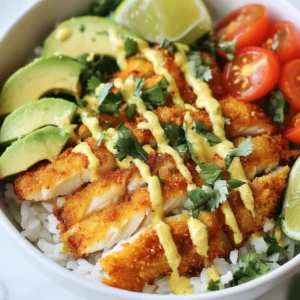 To make crispy fish taco bowls, you will need: - 2 large fillets of white fish (like cod or tilapia) - 1 cup all-purpose flour - 1 teaspoon paprika - 1/2 teaspoon garlic powder - 1/2 teaspoon cumin - Salt and pepper, to taste - 1 cup buttermilk (or regular milk) - 1 cup cornmeal - Vegetable oil, for frying - 2 cups cooked rice (white or brown) - 1 cup shredded green cabbage - 1 avocado, sliced - 1/2 cup cherry tomatoes, halved - 1/4 cup fresh cilantro, chopped - 1 lime, cut into wedges - Spicy mayo (2 tablespoons mayonnaise mixed with sriracha, adjust to taste) For the best outcome, I recommend using: - Fresh cod or tilapia fillets for a mild flavor. - King Arthur flour for a fine texture in the coating. - McCormick spices for consistent flavor in paprika and cumin. - Buttermilk from a local dairy for creaminess. - Stone-ground cornmeal for extra crunch in the coating. If you need to swap some items, consider these options: - Use another white fish like haddock or even shrimp for variety. - Almond flour can replace all-purpose flour for a gluten-free option. - Greek yogurt mixed with water can substitute for buttermilk. - For a lighter meal, replace rice with quinoa or lettuce wraps. - Use a mix of chopped bell peppers instead of cabbage for crunch. {{ingredient_image_1}} Start by slicing the fish fillets into strips. Aim for strips about 1 inch wide. This size helps them cook evenly and makes them easy to eat. In a shallow bowl, mix together the flour, paprika, garlic powder, cumin, salt, and pepper. This blend adds flavor to the fish. In a second bowl, pour the buttermilk. The buttermilk helps the coating stick. In a third bowl, add the cornmeal. You will coat each fish strip in three steps: first, dip it in the seasoned flour, then the buttermilk, and finally, coat it with cornmeal. Press gently to make sure the cornmeal sticks well. Heat about 1/2 inch of vegetable oil in a large skillet over medium-high heat. The oil should be hot enough to sizzle when you add the fish. Fry the strips in batches, making sure not to crowd the pan. Cook each strip for about 3-4 minutes per side, until they turn golden and crispy. Remove them and drain on paper towels to get rid of extra oil. Now, your crispy fish is ready for the taco bowls! To get that perfect crunch, the coating matters a lot. Start with fresh fish. Cut the fish into strips about 1 inch wide. This helps them cook evenly. Use a mix of flour, cornmeal, and spices for a great crust. The cornmeal gives extra crunch. The buttermilk helps the coating stick. This creates a moist inside and crispy outside. Use enough oil for frying. Heat about half an inch of vegetable oil in a skillet. The oil should be hot but not smoking. You can test it by dropping a small piece of fish in the oil. If it sizzles, you are ready to fry. Do not overcrowd the pan. Fry them in batches to keep the heat steady. This way, each piece gets crispy and golden. Seasoning is key for tasty fish taco bowls. Use a blend of paprika, garlic powder, and cumin. These spices add warmth and depth. Adjust salt and pepper to your taste. You can also add lime juice to brighten the flavors. Don't forget the spicy mayo! Mix mayonnaise with sriracha for a kick. Drizzle it on top of the fish for extra zing. Pro Tips Keep the Oil Hot: Ensure the oil is at the right temperature before frying. If it’s not hot enough, the fish will absorb too much oil and become greasy. Use Fresh Ingredients: Fresh fish and produce will enhance the flavor and presentation of your taco bowls, making every bite more delicious. Customize Your Toppings: Feel free to add other toppings like diced red onions, jalapeños, or a sprinkle of feta cheese for added flavor and texture. Make Ahead: You can prep the fish and toppings in advance. Just fry the fish right before serving to keep it crispy. {{image_2}} You can use many kinds of fish for taco bowls. Cod and tilapia are great choices. They stay flaky and tender when cooked. You could also try mahi-mahi or halibut for a richer taste. If you like a stronger flavor, use salmon. It works well in tacos, too. Just make sure to cut the fish into strips for easy frying. Toppings can change your taco bowl game. Shredded cabbage adds crunch and color. You can use purple cabbage for a vibrant twist. Sliced radishes bring a spicy kick, while pickled onions offer a tangy flavor. Try adding mango salsa for a sweet touch. You can also use black beans for extra protein. The lime juice brightens everything up, making each bite refreshing. Crispy fish taco bowls can be made plant-based. Use firm tofu or tempeh instead of fish. Coat it in the same flour mix and fry until golden. Cauliflower also works well. Just break it into florets, season, and fry. For toppings, use avocado, fresh veggies, and a vegan mayo mix. This way, you get a tasty bowl, even without fish! To store leftover fish taco bowls, place the fish and toppings in separate containers. This keeps the fish crispy and the toppings fresh. Use an airtight container for the fish and a salad container for the veggies. Refrigerate within two hours after cooking. The fish will stay good for up to two days. When reheating, keep the fish crispy. Preheat your oven to 375°F (190°C). Place the fish on a baking sheet. Heat for about 10-12 minutes. This helps the fish regain its crunch. Avoid using the microwave, as it may make the fish soggy. You can reheat the rice and toppings separately in the microwave. You can freeze the fish before cooking. Coat the fish and place it on a baking sheet. Freeze until solid, then transfer to a freezer bag. This keeps the fish fresh for up to three months. For already cooked fish taco bowls, freezing is not recommended. The texture may change, and the fish may not taste as good after thawing. To make the fish extra crispy, follow these steps: - Use cold buttermilk for dipping. This helps create a nice crust. - Make sure your oil is hot enough before frying. Test it with a small piece of fish. - Coat the fish in flour, buttermilk, and cornmeal, pressing firmly. This helps the crust stick. - Fry in small batches. Too much fish at once cools the oil, making it soggy. Crispy fish stays crispy when served right away. If you let it sit, it may lose its crunch. Serve it hot for the best taste! Yes, you can make the spicy mayo ahead of time. Mix 2 tablespoons of mayonnaise with sriracha. Adjust the sriracha to your taste. - Store it in an airtight container in the fridge. - Let it chill for at least 30 minutes before serving. This helps the flavors blend well. Making it early saves time on busy days. Plus, it adds a nice kick to your bowls! Fish taco bowls pair well with several sides. Here are my favorites: - Black beans: They add protein and a nice texture. - Corn salad: Sweet corn complements the fish well. - Chips and guacamole: This gives a crunchy contrast to the soft fish. - Grilled vegetables: They provide a healthy, colorful touch. Choose sides that balance the flavors of your fish taco bowls. Enjoy your meal! In this article, we explored delicious fish taco bowls. We discussed essential ingredients, step-by-step cooking, tips for crispiness, and exciting variations. We also covered proper storage for leftovers. Fish taco bowls can impress anyone. With simple steps, you can enjoy tasty meals anytime. Don’t hesitate to try different fish or toppings. Cooking can be fun and rewarding. Enjoy your culinary adventure!