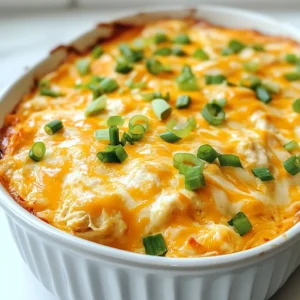 - 2 cups cooked shredded chicken - 1 package (8 oz) cream cheese, softened - 1 cup Frank's RedHot sauce or favorite hot sauce - 1 cup ranch dressing - 1 cup shredded cheddar cheese - 1/2 cup crumbled blue cheese (optional) - 1 tablespoon garlic powder - 1 tablespoon onion powder - 1/4 cup green onions, chopped (for garnish) For Frank’s Buffalo Chicken Dip, you need simple and tasty ingredients. The first star is the cooked shredded chicken. It gives the dip its hearty flavor. Next is cream cheese. It makes the dip creamy and smooth. Frank's RedHot sauce is the key to that spicy kick. You can use any hot sauce you like, but Frank's is a classic. Ranch dressing adds a nice, tangy taste that balances the heat. Shredded cheddar cheese melts beautifully and adds richness. If you like blue cheese, you can sprinkle some on top for a strong flavor. Garlic powder and onion powder boost the taste further. Finally, don’t forget the green onions. They add a fresh crunch on top. This mix of ingredients creates a dip that is perfect for parties and gatherings. Every bite is packed with flavor! {{ingredient_image_1}} Start by preheating your oven to 350°F (175°C). This step is key for getting that perfect melt. In a large mixing bowl, combine the softened cream cheese, Frank's RedHot sauce, and ranch dressing. Mix these ingredients until they blend smoothly. You want a creamy base that is well incorporated. Next, stir in 2 cups of cooked shredded chicken. This is where the dip gets its heartiness. Add in the garlic powder, onion powder, and half of the shredded cheddar cheese. Mix everything well. The spices add flavor, making each bite exciting. Now it’s time to transfer the mixture to a baking dish. Spread it evenly for even cooking. Sprinkle the remaining cheddar cheese and crumbled blue cheese on top if you like. Bake your dip in the preheated oven for 20-25 minutes. Look for bubbly edges and slightly golden cheese. This is when the magic happens! Once done, let it cool a bit before serving. Enjoy it warm with your favorite dippers. To get the best cheese consistency, use brick cream cheese. It mixes better than whipped cream cheese. Make sure the cream cheese is at room temperature. This helps it blend smoothly with the other ingredients. For a creamier texture, add more ranch dressing. You can also mix in Greek yogurt for a tangy twist. If you want it extra creamy, try mixing in more cheese. For dipping, tortilla chips are my favorite. They add a nice crunch. You can also use celery sticks for a fresh, crisp taste. Crackers work well too, especially buttery ones. Serve the dip warm for the best flavor. It stays good for a while in the oven. Just keep an eye on it to make sure it doesn’t get too hot. Pro Tips Use Fresh Ingredients: Freshly cooked chicken and high-quality cheeses will elevate the flavor of your dip. Adjust Spice Level: Feel free to mix in additional hot sauce or use a milder sauce to customize the heat to your preference. Make It Ahead: Prepare the dip a day in advance and keep it in the fridge. Bake it just before serving for a fresh taste. Experiment with Dippers: Try using different dippers like pita chips, carrot sticks, or even bread for a unique twist. {{image_2}} You can make Frank’s Buffalo Chicken Dip even better by mixing in different cheeses. Adding mozzarella gives it a melty texture. Pepper jack can add a fun kick. You can also play with the spice level. If you want it hotter, add more Frank's RedHot sauce. If you prefer it milder, use less. This makes the dip just right for your taste. You can swap ranch dressing for blue cheese dressing to change the flavor. This adds a tangy twist. If you want a lighter dip, try using Greek yogurt instead of cream cheese. Greek yogurt gives a nice creamy texture while cutting down on fat. These swaps let you create a dip that fits your needs. After your gathering, store any leftover Frank’s Buffalo Chicken Dip in an airtight container. Let the dip cool to room temperature first. Once cooled, seal it tightly and place it in the fridge. It will stay fresh for about three to four days. When you want to enjoy it again, just reheat it in the oven or microwave until warm. If you want to keep it longer, freezing is a great option. To freeze, first let the dip cool completely. Then, place the dip in a freezer-safe container. Make sure to leave some room at the top, as the dip will expand when frozen. You can freeze it for up to three months. To reheat, thaw it overnight in the fridge. Then, warm it in the oven at 350°F (175°C) until it's hot and bubbly. Enjoy your dip even after the party! Can I make this dip ahead of time? Yes, you can make this dip ahead of time. Prepare the dip and place it in a baking dish. Cover it and store it in the fridge for up to 24 hours. When ready to serve, just bake it until hot and bubbly. How spicy is Frank's RedHot sauce compared to other hot sauces? Frank's RedHot sauce has a medium heat level. It is milder than many other hot sauces. If you want more heat, try adding more sauce or use a spicier brand. What can I serve with Frank’s Buffalo Chicken Dip? This dip pairs well with many snacks. You can serve it with tortilla chips, celery sticks, or crackers. Veggie sticks work great, too! Make sure to have plenty for dipping. This blog post highlights the tasty Frank’s Buffalo Chicken Dip recipe. You learned about the key ingredients, step-by-step instructions, and handy tips to make it perfect. I shared variations to fit your taste and ways to store leftovers. Now, you can enjoy a flavorful dip for parties or game days. Keep experimenting with different ingredients to find your favorite combo. With this guide, impress friends and family with your easy and delicious dip. Enjoy making and sharing it!