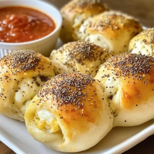 To make stuffed bagel bombs, you need a few simple ingredients. Here’s what you will need: - 2 cups all-purpose flour - 1 teaspoon instant yeast - 1 teaspoon salt - ¾ cup warm water (about 110°F) - 1 tablespoon honey - 1 tablespoon olive oil - 1 cup shredded mozzarella cheese - ½ cup cream cheese, softened - ¼ cup finely chopped chives - 1 tablespoon garlic powder - 1 large egg (for egg wash) - Everything bagel seasoning (for topping) These ingredients combine to create soft dough and a rich filling. The flour and yeast form the base. The honey and olive oil add flavor and moisture. The cheeses, chives, and garlic powder create a delicious filling. This mix of flavors makes each bite special. When shopping, look for fresh ingredients. Fresh chives and quality cheese enhance the taste. If you want to save time, check for pre-shredded cheese. Each ingredient plays a key role in making your bagel bombs tasty and fun. You can customize your filling too, but this mix is a great start. {{ingredient_image_1}} Start by mixing warm water, honey, and instant yeast in a large bowl. Let this mixture sit for about five minutes. You will see it bubble, which shows that the yeast is active. Once bubbly, add olive oil, salt, and flour. Stir until a dough forms. Next, turn the dough onto a floured surface. Knead it for about five to seven minutes. The dough should feel smooth and elastic. Once done, place it in a lightly greased bowl. Cover it with a damp cloth and let it rise in a warm spot for about one hour. It should double in size during this time. While the dough rises, make the filling. In a medium bowl, mix together shredded mozzarella cheese, softened cream cheese, chopped chives, and garlic powder. Make sure everything is well combined. Set this filling aside for later. Once the dough has risen, punch it down gently. Turn it out onto a floured surface. Divide the dough into eight equal parts. Flatten each part into a circle. Place about two tablespoons of the cheese filling in the center. Fold the edges over the filling to form a ball. Pinch the edges tightly to seal. Preheat your oven to 425°F (220°C). In a large pot, bring water to a boil. Carefully drop in the stuffed dough balls, a few at a time. Boil them for about one to two minutes on each side. They will puff up slightly. Use a slotted spoon to remove them and place them on a parchment-lined baking tray. Now, brush the tops of each bagel bomb with the beaten egg. Sprinkle everything bagel seasoning over the top. Bake them in the preheated oven for about 15 to 18 minutes. They should turn golden brown. Let them cool slightly before serving. Enjoy them warm! Kneading the dough is key. It helps develop gluten, which gives the bagels their chewy texture. Knead for 5-7 minutes until smooth. To ensure a successful rise, keep the dough in a warm place. Cover it with a damp cloth to keep it moist. Look for the dough to double in size. This means it’s ready for the next step. You can get creative with the fillings. Try different cheeses like cheddar or pepper jack. Fresh herbs like basil or dill can add great flavor too. For a vegan option, use dairy-free cheese or a nut-based cream cheese. You can also add veggies like spinach or roasted peppers for extra taste. Serve your bagel bombs with tasty dips. Marinara sauce or ranch dressing works well. You can also pair them with a light salad for a complete meal. For a nice presentation, arrange the bagel bombs on a wooden board. Add a small bowl of dipping sauce in the center. This makes it fun for gatherings and parties. Pro Tips Perfect Dough Texture: Ensure your dough is smooth and elastic by kneading it well for at least 5-7 minutes. This will help achieve a chewy bagel-like texture. Chill the Filling: For a firmer filling, chill the cheese mixture in the refrigerator for about 15 minutes before using. This makes it easier to handle when forming the bombs. Boiling Water Tips: Make sure the water is at a rolling boil before adding the dough balls. This step is crucial for getting that classic bagel texture and shine. Season Generously: Don’t skimp on the everything bagel seasoning! A generous sprinkle on top will enhance flavor and make your bagel bombs visually appealing. {{image_2}} You can get creative with fillings for stuffed bagel bombs. One tasty option is pepperoni and mozzarella. Just mix pepperoni with mozzarella cheese for a fun twist. The pepperoni adds a nice spice, while the mozzarella gives that classic, gooey texture. Another great combination is spinach and feta. This mix is fresh and savory. The spinach brings a healthy touch, while the feta adds a salty kick. Both options are sure to please! If you want something sweet, try cinnamon sugar stuffed bagels. Mix sugar with cinnamon and fill the dough for a dessert treat. These are perfect for brunch or a snack! For an even richer option, go for chocolate cream cheese filling. Just blend cream cheese with chocolate and scoop it into the dough. These sweet bagel bombs are sure to be a hit! You can also make stuffed bagel bombs to fit different diets. For those needing gluten-free options, use gluten-free flour. This way, everyone can enjoy these bites. If you prefer low-carb alternatives, you can swap regular flour for almond flour. This keeps the flavor while cutting carbs. Enjoy these tasty snacks without worry! To keep your stuffed bagel bombs fresh, store them in the fridge. Place them in an airtight container. This helps keep them moist and tasty. They can last for 3 to 4 days in the fridge. When you're ready to enjoy them again, reheating is simple. Preheat your oven to 350°F (175°C). Place the bagel bombs on a baking sheet. Heat for about 10 minutes until warm. This keeps the outside crispy and the inside soft. If you want to keep them longer, freezing is a great option. First, let the bagel bombs cool completely. Then, wrap each one in plastic wrap. Place them in a freezer bag or container. They can stay in the freezer for up to 3 months. For thawing, take them out of the freezer and let them sit in the fridge overnight. You can also thaw them at room temperature for a few hours. Once thawed, reheat them in the oven at 350°F (175°C) for about 10 minutes. This way, they taste fresh and delicious again. The dough has risen enough when it doubles in size. You can check this by gently pressing your finger into the dough. If it springs back slowly, it is ready. If it stays down, let it rise a bit longer. A warm spot works best for rising. Yes, you can prepare stuffed bagel bombs ahead of time. Make the dough and filling, then shape the bombs. Wrap them tightly and store in the fridge for a day. For longer storage, freeze them. Just let them thaw in the fridge overnight before cooking. To reheat, you can use an oven or an air fryer. Preheat the oven to 350°F. Place the bagel bombs on a baking sheet and bake for about 10 minutes. This keeps them crispy. An air fryer works well too; reheat for 5-7 minutes at 350°F. Absolutely! You can mix things up with different seasonings. Try adding Italian herbs or spicy chili flakes to the dough. You can also top them with sesame seeds or garlic salt instead of everything bagel seasoning. Make each batch unique to your taste! You learned how to make stuffed bagel bombs from scratch. We covered the dough, filling, and cooking process. The tips can help you perfect your technique. You can customize the flavors to suit your taste. Storage options ensure enjoyment later. Try different fillings and toppings to keep it fun. With this guide, you can easily impress friends and family. Enjoy making and sharing your creations!
